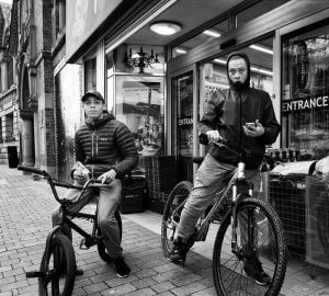 A hat-wearing man captured through street photography.