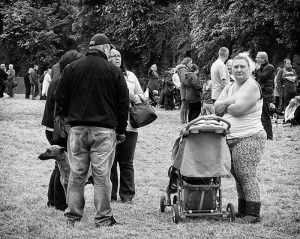 Street photography of people in a park.