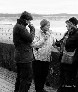 Street photography of people talking.