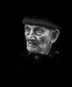 Street photography black and white photo of an old man.