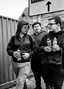 Street photography of a group walking on a street.