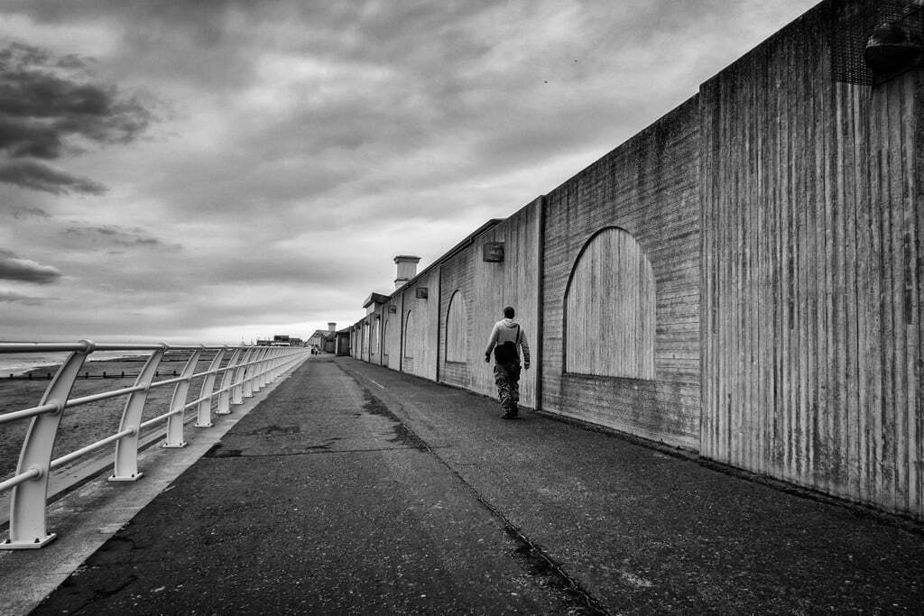 Lone man walking Rhyl seafront