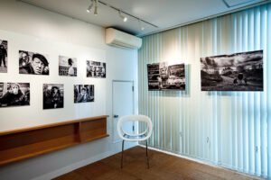A room adorned with a collection of photographs from around the world, including captivating snapshots of Yorkshire and Tokyo.
